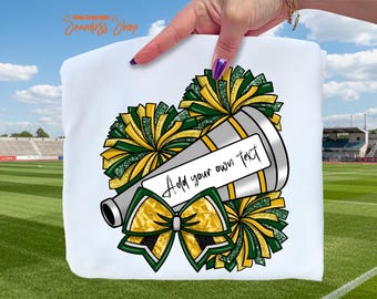 May include: White graphic featuring a megaphone, pom-poms, and a bow in green, gold, and silver. The megaphone has a space to add text. Cheerleading-themed design.