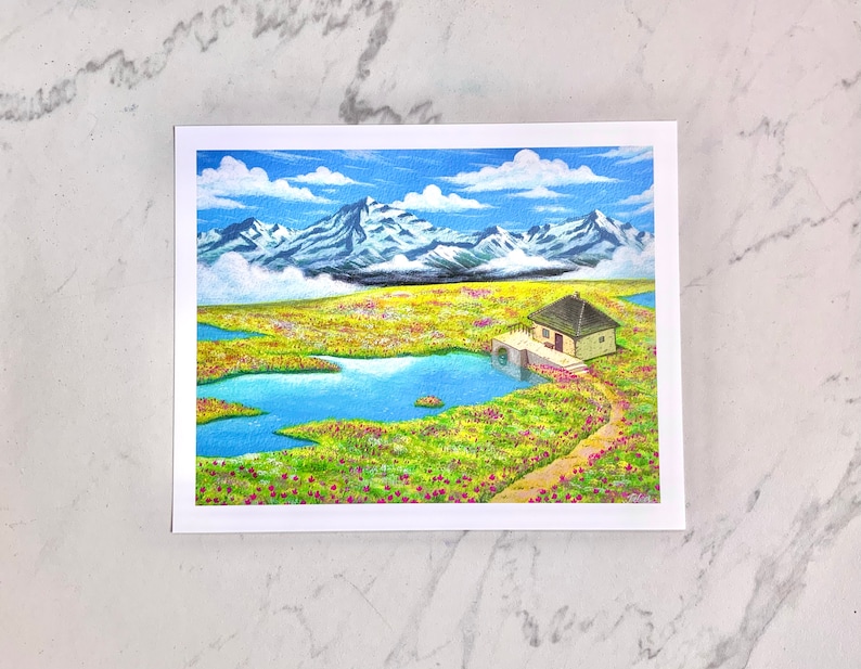 May include: A watercolour painting depicting a small house with a brown roof situated in a field of yellow flowers. The house is close to a small lake and a path leads towards it. The background features a mountain range with snow-capped peaks.
