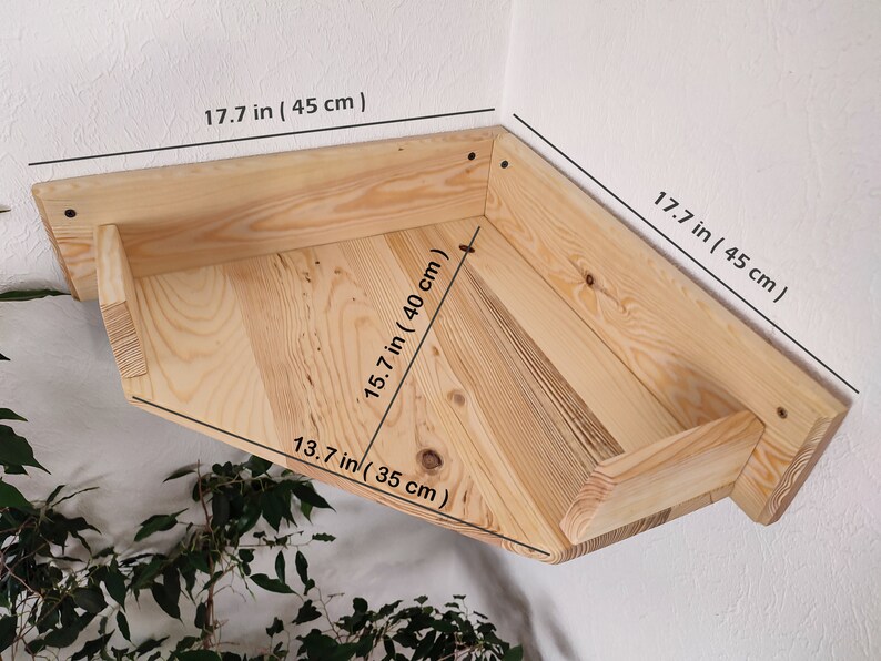 May include: A wooden corner shelf with a chevron pattern, measuring 17.7 inches by 17.7 inches by 15.7 inches.