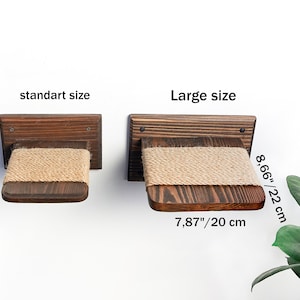 May include: Two wooden cat shelves with sisal rope, one is 7.87 inches wide and 20 cm long, the other is 8.66 inches wide and 22 cm long. The shelves are mounted on a white wall.