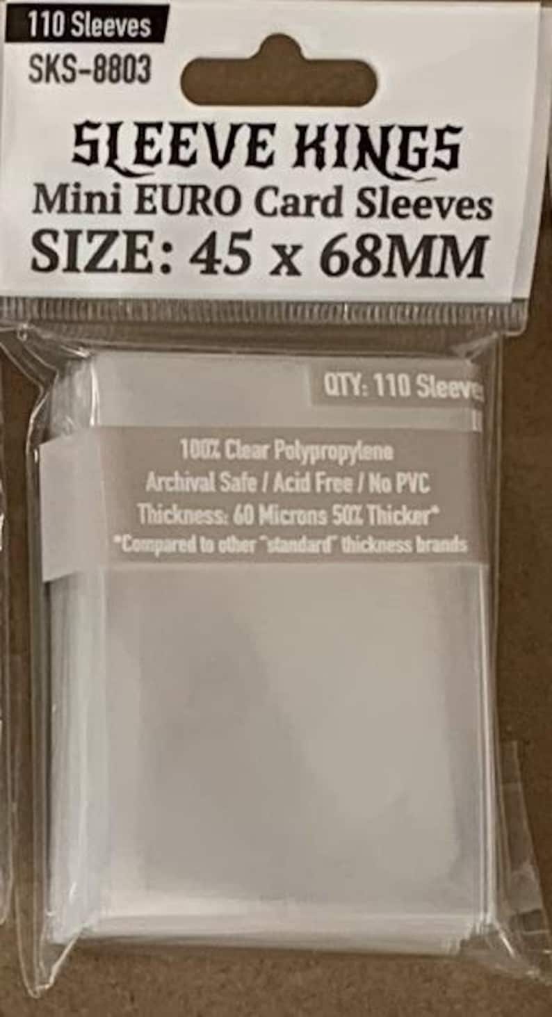 May include: Clear plastic card sleeves from Sleeve Kings, labeled as Mini Euro Card Sleeves, with dimensions of 45 x 68mm. The package indicates 110 sleeves, made of clear polypropylene, archival safe, and acid-free.