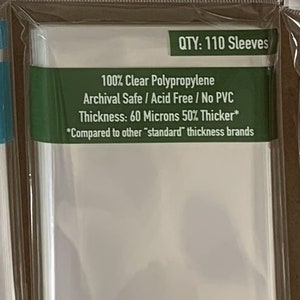 May include: Clear card sleeves by Sleeve Kings, labeled "WOTR" with a size of 70 x 120mm. The package indicates 110 sleeves, made of clear polypropylene, archival safe, acid-free, and no PVC. The thickness is 60 microns, 50% thicker than standard brands.