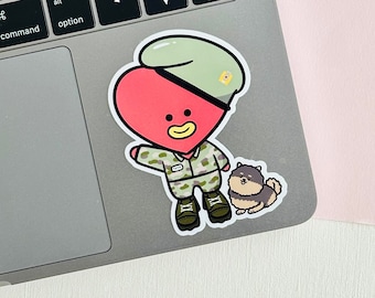 May include: A red heart-shaped character wearing a camouflage uniform and a green hat with a yellow star. The character is holding a small brown dog with a white collar.