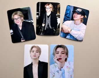 May include: Set of five rectangular photo magnets. Each magnet features a different image of a person with blonde hair. The images show the person in various outfits and settings, including wearing glasses and a baseball cap.