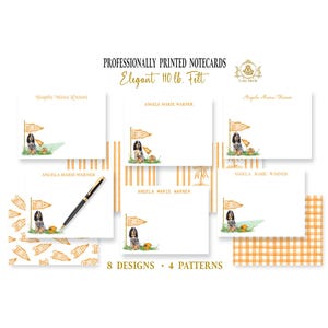 May include: A collection of white notecards featuring a dog illustration with a pennant flag and pumpkin, personalized with the name Angela Marie Warner. The set includes 8 designs and 4 patterns, with text reading PROFESSIONALLY PRINTED NOTECARDS Elegant 110 lb. Felt.