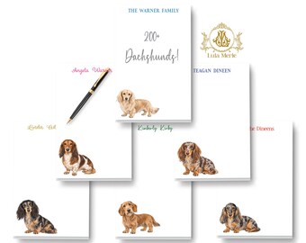 May include: A collection of white rectangular stationery notepads featuring various illustrations of long-haired dachshund dogs in different colors and patterns. Each notepad includes personalized names, the text 200+ Dachshunds!, and a black pen.