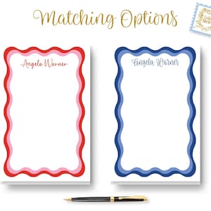 May include: Two blank note cards with wavy borders. The card on the left has a red, pink, and white border. The card on the right has a blue and white border. Both cards have the name "Angela Warner" written at the top.