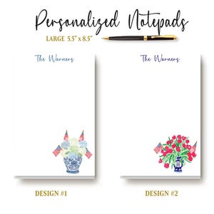 May include: Two white personalized notepads measuring 5.5 inches by 8.5 inches, each featuring the text The Warners. Design 1 shows a blue and white vase with hydrangeas and American flags. Design 2 shows a blue and white vase with red flowers and American flags. A black pen is included.