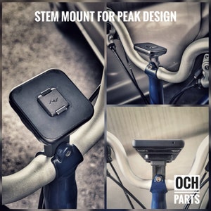 May include: A black bike stem mount with a square base and a round top. The mount is attached to a silver handlebar. The mount is designed to hold a phone or other device. The text "STEM MOUNT FOR PEAK DESIGN" is visible at the top of the image.