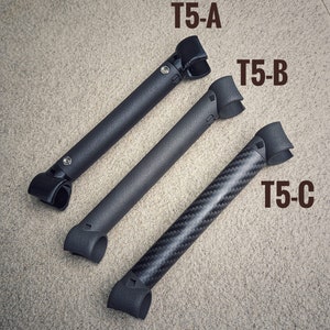 May include: Three black rods with different finishes. The top rod is labeled "T5-A", the middle rod is labeled "T5-B", and the bottom rod is labeled "T5-C".