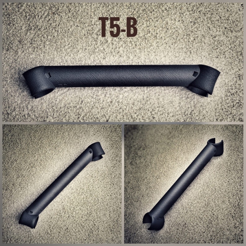 May include: Three black metal pieces with a curved shape. The pieces are labeled "T5-B".