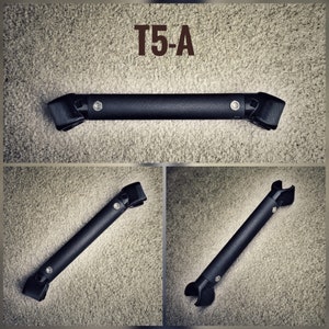 May include: A black metal T5-A bar with a rounded end on each side. The bar is shown in three different positions.