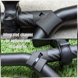 May include: Close-up of a black carbon fiber handlebar with an integrated channel for optional use of a cable tie. The channel is located on the underside of the handlebar.