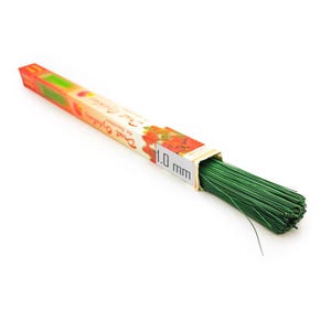 May include: A package of green floral wire, 1.0 mm thick, is displayed on a white background. The wire is bundled together and extends from a colorful cardboard box with text and floral illustrations. The box is orange, red, and green.