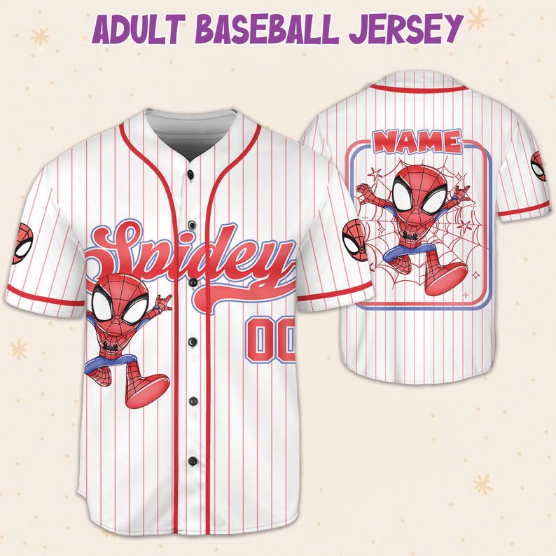 May include: White baseball jersey with red pinstripes, featuring a cartoon Spiderman graphic. The jersey has the word "Spidey" in red script on the front, along with the number "00". The back of the jersey has a Spiderman graphic and the word "NAME".