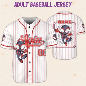 May include: White baseball jersey with red pinstripes, featuring a cartoon character graphic on the front and back. The front has the word "Spin" in red script and the number "00". The back has a name box with a cartoon character and the word "NAME".