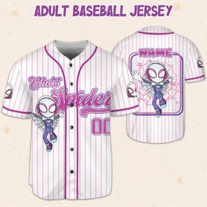May include: White baseball jersey with pink pinstripes, featuring a Ghost Spider graphic and the text "Ghost Spider" in pink. The jersey has the number "00" and the text "ADULT BASEBALL JERSEY" at the top.