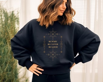 Be Wary Be Clever Be Good Crewneck Sweater Celestial One Dark Window Two Twisted Crowns Rachel Gillig Bookish Sweater