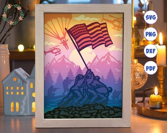 May include: A digital art print of a patriotic scene with a group of soldiers raising an American flag on a mountaintop. The scene is set against a colorful sunset sky with parachutes and helicopters in the background.