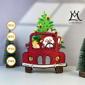 May include: A red Christmas-themed papercraft depicts Santa Claus driving a vintage truck, with a Christmas tree and gifts in the back. The truck has yellow headlights and brown tyres. The image includes the text "SVG", "DXF", "PNG", and "PDF".