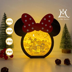 May include: A decorative paper light box shaped like Minnie Mouse's head, with a red bow and white spots. Inside, Mickey and Minnie Mouse are depicted. The text "LilMe Stores" is visible.