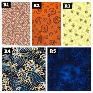 May include: Five fabric swatches featuring a variety of patterns. The first swatch is orange with a white geometric design. The second swatch is orange with a black and white pattern of bicycles, fish, and other objects. The third swatch is yellow with a black and white pattern of bees. The fourth swatch is blue with a gold pattern of waves. The fifth swatch is blue with a dark blue and black pattern.