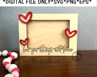 May include: A wooden picture frame with a cutout of three hearts and the text "love you always and forever".