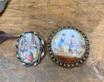 Set of 2 vintage porcelain brooches with Victorian courting painted scenes