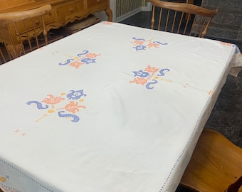Large vintage linen hand embroidered cross stitched tablecloth in peach and blue 66” x 50”
