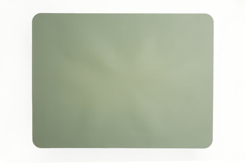 May include: A sage green rectangular placemat made of a textured material.