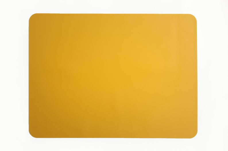 May include: A solid yellow rectangular placemat.
