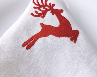 Embroidered Christmas napkins for a gift. Linen white napkins with red embroidery for the festive table.Christmas reindeer napkins