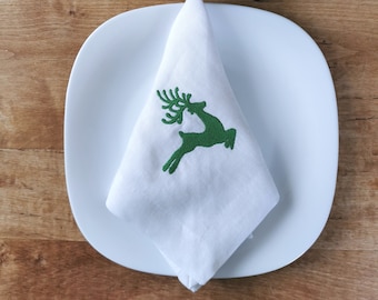 Embroidered Christmas napkins for a gift. Linen white napkins with red embroidery for the festive table.Christmas reindeer napkins