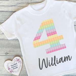 Personalised Custom Pop It Fidget Toy Number Printed Birthday T-shirt. Any Age with multiple design and colour options