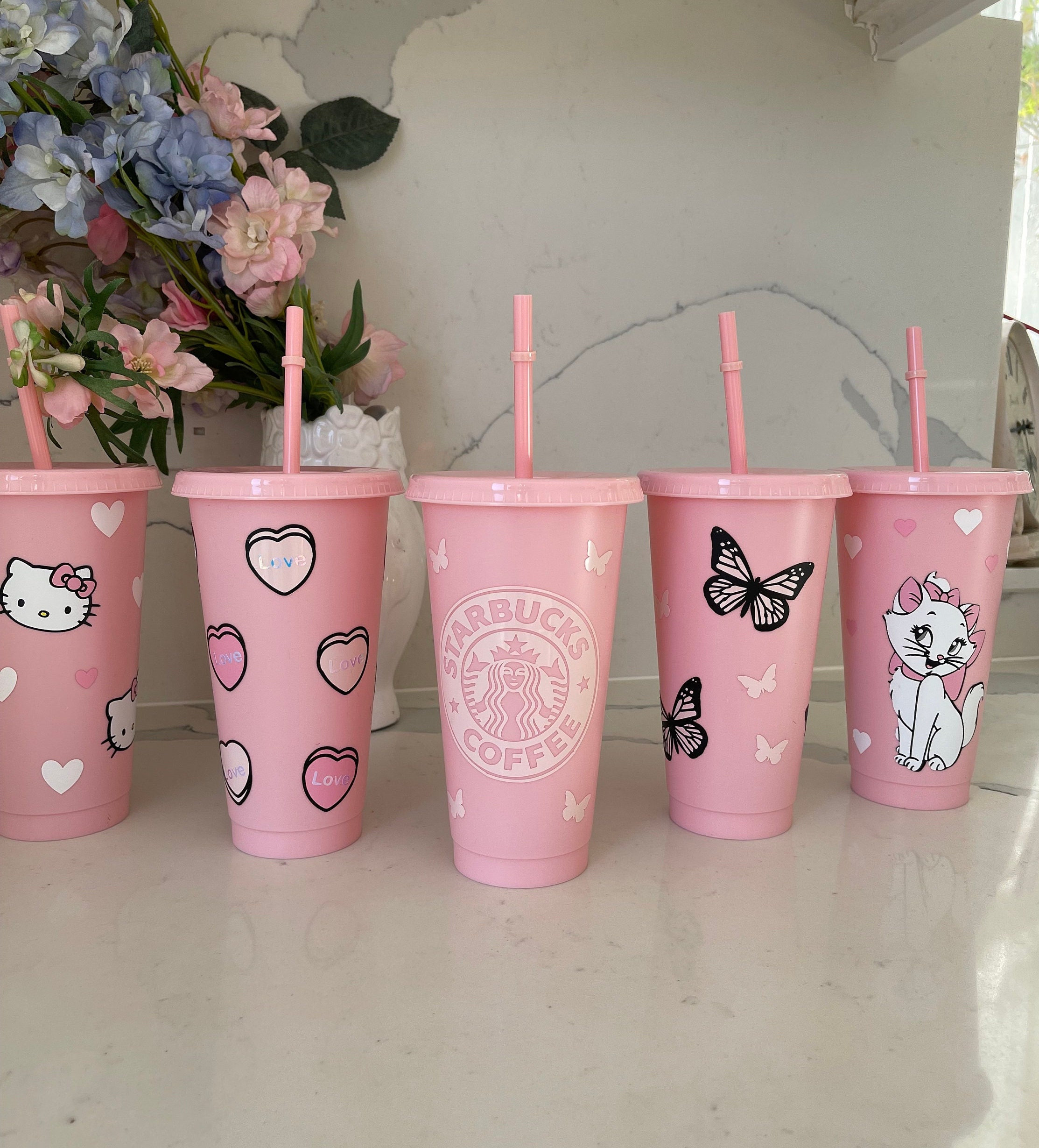 Pink starbucks cup with yellow straws on Craiyon