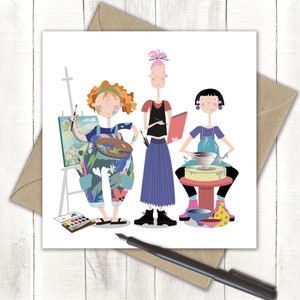 May include: Three female artists, one painting, one sculpting, and one sketching. The painter is wearing a floral jumpsuit and holding a paint palette. The sculptor is wearing a blue and white overall and is working on a pottery wheel. The sketcher is wearing a blue dress and holding a sketchbook.