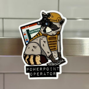 May include: A sticker featuring a cartoon raccoon wearing a hard hat and holding a keyboard. The raccoon is wearing a tactical vest and has night vision goggles on. The sticker says "POWERPOINT OPERATOR" and has a small computer screen with the words "Trash Panda" on it.