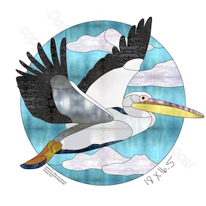 May include: A stained glass pattern of a pelican flying in a blue sky with white clouds. The pattern is in a circle with the text "18 x 16.5" at the bottom.
