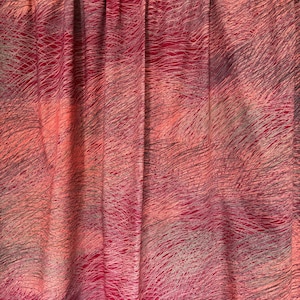 May include: A set of curtains with a vibrant, abstract design. The fabric features a blend of pink, red, and gray hues, with a pattern of fine, wavy lines. The curtains are gathered at the top, creating soft folds.