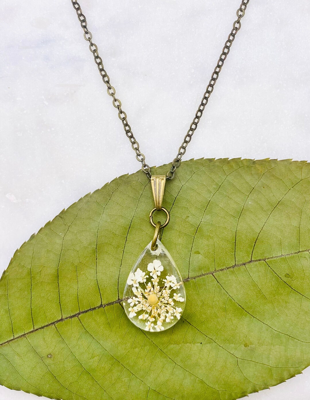 White Wildflower Mustard Seed Teardrop Pendant Necklace, Antique Bronze