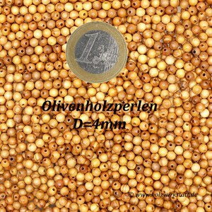 May include: A close-up image of a large pile of small, round, natural wood beads. The beads are a light brown color and have a smooth, polished finish. A 1 Euro coin is included for scale. The text "Olivenholzperlen D=4mm" is visible in the image.