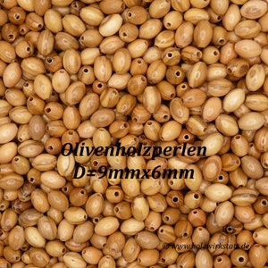 May include: A close-up image of a pile of oval-shaped wooden beads. The beads are a light brown color with darker brown streaks. The beads are approximately 9mm in diameter and 6mm in length. The text "Olivenholzperlen D=9mm x 6mm" is visible in the image.