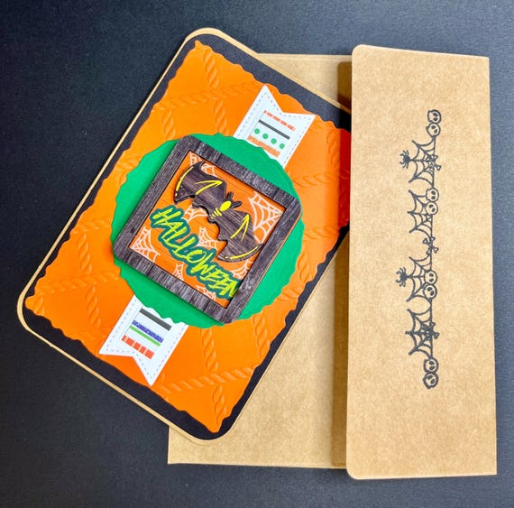Handmade Halloween card, orange and black, wooden sentiment with a bat