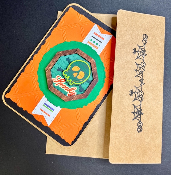 Handmade Halloween card, orange and black, wooden sentiment with a Skull and Crossbones