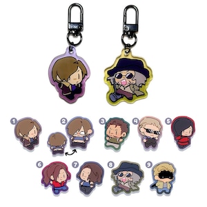 May include: Two keyrings with cartoon character designs. One keyring features a character with brown hair and a purple jacket. The other keyring has a character with a hat and sunglasses. Nine additional character designs are below.