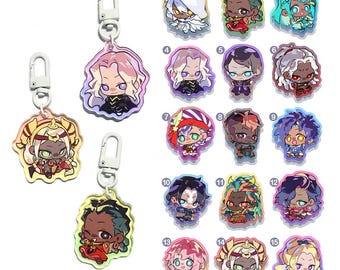 May include: A collection of fifteen acrylic keychains featuring chibi-style anime characters with diverse hair colors, outfits, and expressions. Each charm is numbered one through fifteen and includes a white plastic lobster clasp attachment.