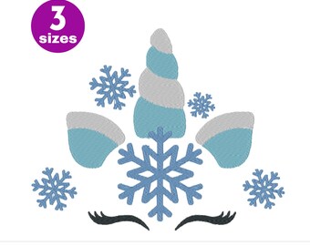 May include: A blue and white unicorn head with a snowflake horn and snowflakes around the head. The unicorn has black eyelashes.