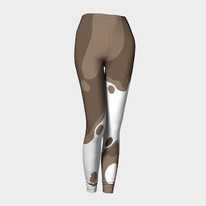 May include: Brown and white abstract print leggings. The leggings have a swirling pattern of brown and white.