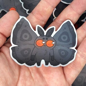 Cute Mothman Holo Sticker – mothman cryptid stickers – holographic cryptid decal – cute alien stickers – funny mothman holographic stickers