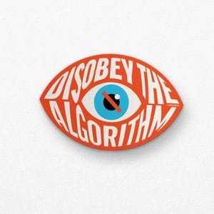 May include: An orange, eye-shaped sticker with the words "DISOBEY THE ALGORITHM" in white text. The eye has a blue iris with a black line through it.